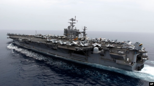 FILE - A general view shows the nuclear-powered aircraft carrier USS Harry S. Truman at an undisclosed position in the Mediterranean Sea.
