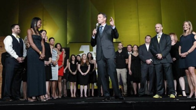 Lance Armstrong stands onstage during the 15th anniversary celebration for Livestrong, his cancer-fighting charity, in Austin, Texas, on October 19, 2012.