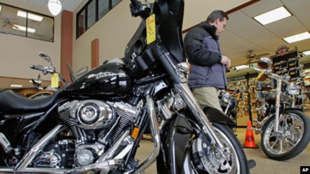 Customers admire and look at the new Harley-Davidson motorcycles at the Hall's Harley Davidson dealership in Springfield, Ill. Harley-Davidson's second-quarter profit more than doubled as it posted its first U.S. sales increase since 2006, (File)