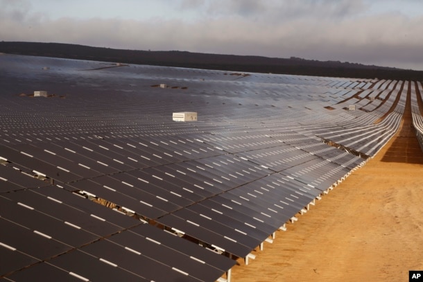 FILE - A photovoltaic solar park situated on the outskirts of the coastal town of Lamberts Bay, South Africa.