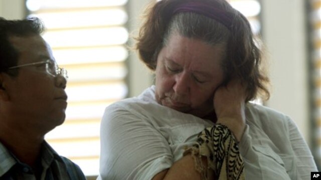 Lindsay Sandiford stands next to her interpreter as her verdict is announced at a courthouse in Bali on Tuesday, Jan. 22, 2013. 