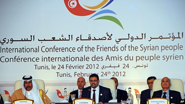 Tunisian foreign minister Rafik Abdessalem, center, opens the Conference on Syria in Tunis, Tunisia, February 24, 2012.