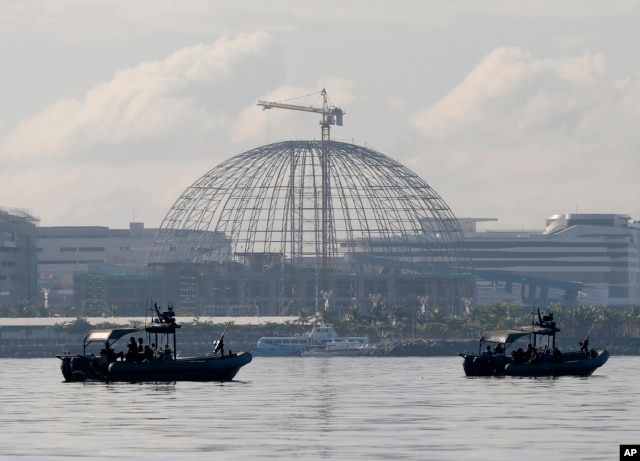 Patrol boats of the Philippine Navy Special Operations Group are positioned near the venue as they implement a no-sail zone policy at the restricted zone for next week's APEC (Asia-Pacific Economic Cooperation) Summit of Leaders Friday, Nov. 13, 2015.