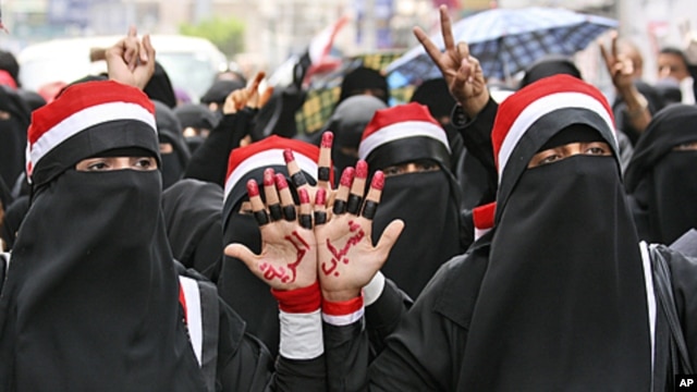 Female anti-government protesters, chant slogans during a demonstration demanding the resignation of Yemeni President Ali Abdullah Saleh, in Taiz, June 14, 2011