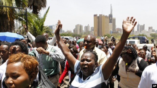 Striking public health workers participate in a demonstration as they enter the Ministry of Health headquarters in Kenya's capital Nairobi, March 9, 2012. 