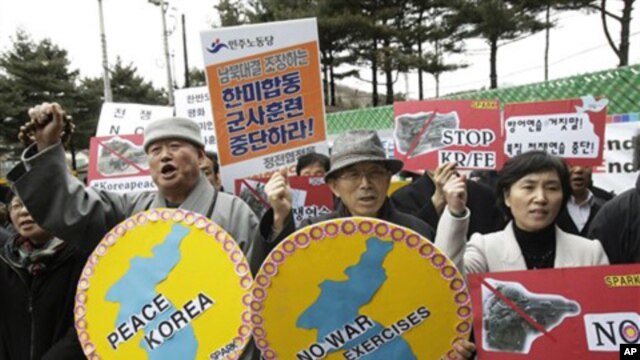 South Korean protesters rally against the annual joint military exercises between South Korea and the United States in front of the South Korean and United States War Command Center in Seongnam, South Korea, Feb. 28, 2011.