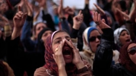 Egyptian protesters chant anti-government slogans during a rally in Tahrir Square, Cairo, Egypt, Feb. 1, 2013. 