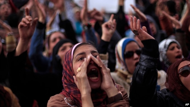 Egyptian protesters chant anti-government slogans during a rally in Tahrir Square, Cairo, Egypt, Feb. 1, 2013. 