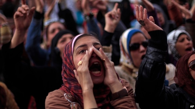 Egyptian protesters chant anti-government slogans during a rally in Tahrir Square, Cairo, Egypt, Feb. 1, 2013.