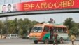 A soldier walks near a bus as he helps to secure the area and clear the roads before the motorcade of Chinese Premier Li Keqiang passes by in Islamabad, May 22, 2013. 
