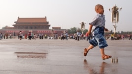 A boy runs on Tiananmen Square in Beijing on June 3, 2012, on the eve of the 23rd anniversary of China's brutal crackdown on democracy protests.
