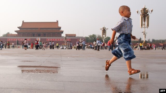 A boy runs on Tiananmen Square in Beijing on June 3, 2012, on the eve of the 23rd anniversary of China's brutal crackdown on democracy protests.