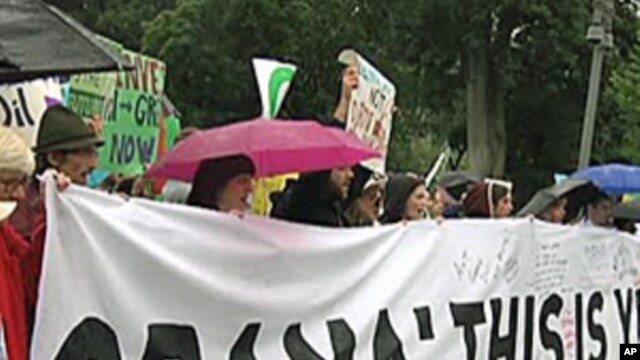 Environmentalists protest the Gulf of Mexico oil spill in front of the White House
