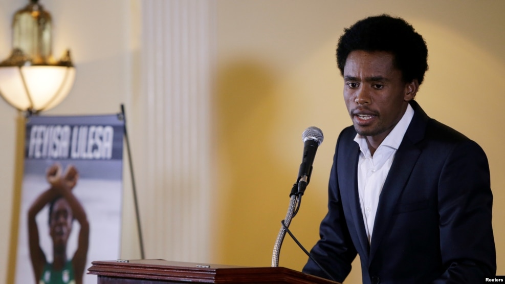 Rio Olympic marathon silver medalist Feyisa Lilesa of Ethiopia attends a news conference in Washington, Sept. 13, 2016. 