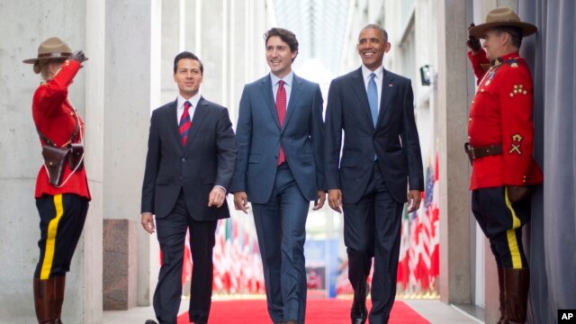 President Barack Obama (R) walks with Canadian Prime Minister Justin Trudeau (C) and Mexican President Enrique Pena Nieto at the National Gallery of Canada in Ottawa, Canada, June 29, 2016. Obama traveled to Ottawa for the North America Leaders' Summit.