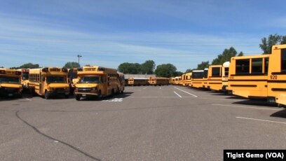 A fleet of Metropolitan Transportation Network buses in a parking lot at the company's headquarters in Fridley, Minnesota, Aug. 10, 2017.