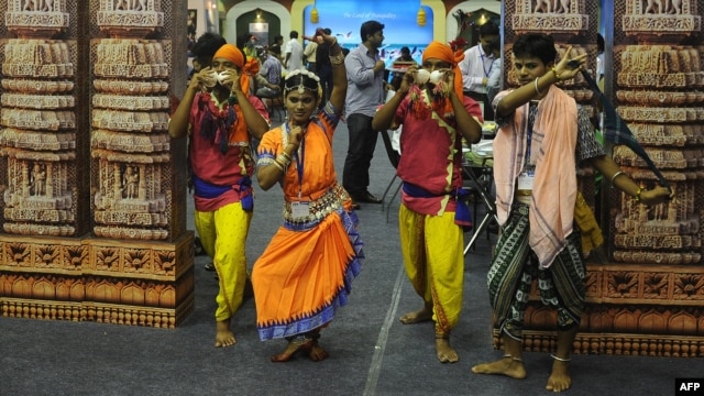 Indian folk artists from the eastern Indian state of Orissa perform during the three-day long Travel and Tourism Fair in Kolkata, July 13, 2012.
