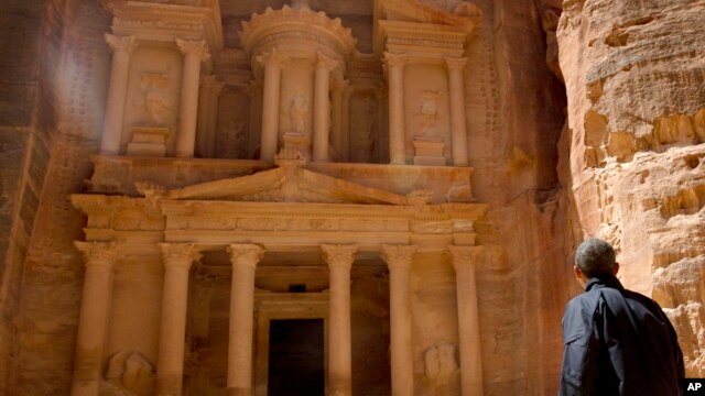 U.S. President Barack Obama stops to look at the Treasury during his tour of the ancient city of Petra, Jordan, March 23, 2013.  