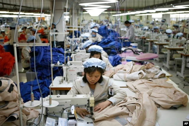 FILE - North Korean workers assemble jackets at a factory of a South Korean-owned company at the jointly run Kaesong Industrial Complex in Kaesong, North Korea.