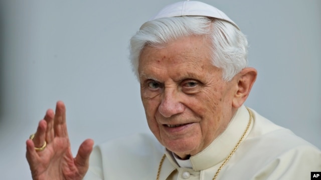Pope Benedict XVI delivers his blessing as he arrives for a weekly general audience in St.Peter's Square at the Vatican, October 3, 2012. 