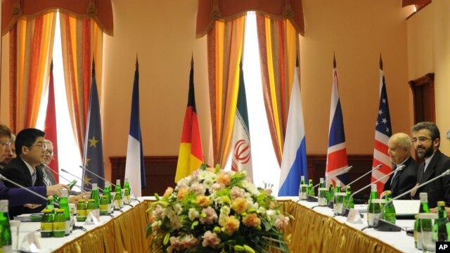 EU foreign policy chief Catherine Ashton, left, and chief Iranian nuclear negotiator Saeed Jalili, right, meet in Moscow, June 18, 2012.