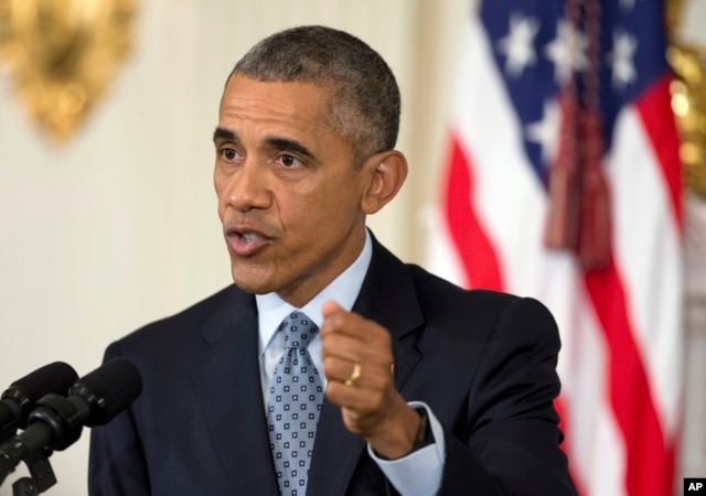 President Barack Obama speaks to reporters in the State Dining Room of the White House in Washington, Oct. 2, 2015.