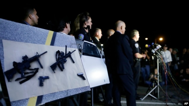 Police crime photos are displayed during a Dec. 4 press conference in San Bernardino, Calif.