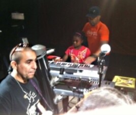 Akeylah Hunter playing piano at the House of Blues in Boston during a sound check with Michael Franti and his band.