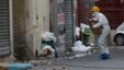 FILE - A police officer enters the building where a raid occurred in Saint-Denis, France, a few days after terrorist attacks in Paris, Nov. 19, 2015. France's prime minister warned at the time that terrorists might at some point use chemical or biological weapons.