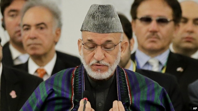 Afghan President Hamid Karzai delivers a speech (July 8 2012 file photo)