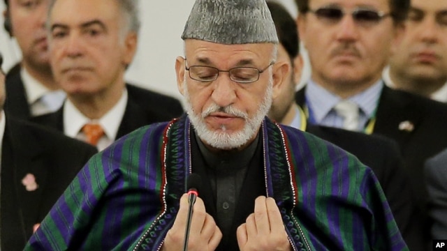Afghan President Hamid Karzai delivers a speech (July 8 2012 file photo)