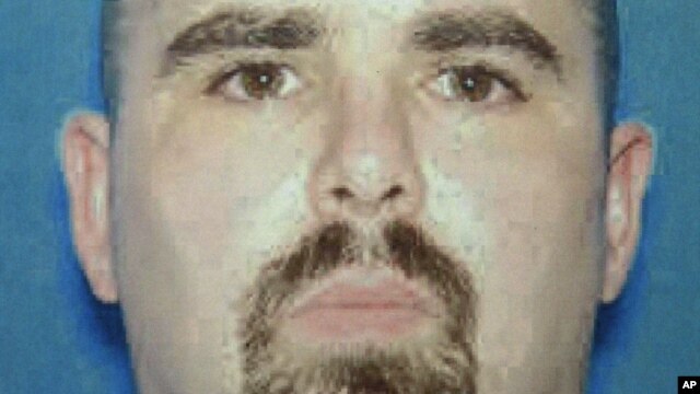 This undated photo provided by the FBI on Aug. 6, 2012 shows Wade Michael Page, a suspect in the Sunday, Aug. 5, 2012 Sikh temple shootings in Oak Creek, Wis. 
