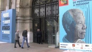 Visitors enter the Nelson Mandela exhibit in Paris