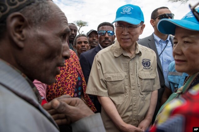 FILE - U.N. Secretary-General, Ban Ki-Moon, center, listens to Ziway Dugda district community members in a drought-stricken area in Ziway Dugda, Ethiopia, Jan. 31, 2016.