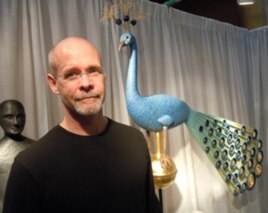 Sculptor Mark Perry sells works such as his hand-carved peacock for $25,000.