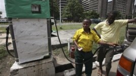 A man buys fuel at a petrol station in Lagos, Nigeria, April 24, 2012. 