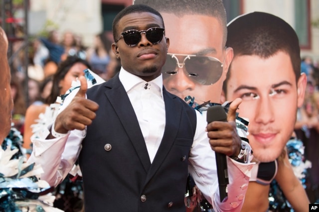 OMI arrives at the Much Music Video Awards, June 21, 2015, in Toronto, Canada.