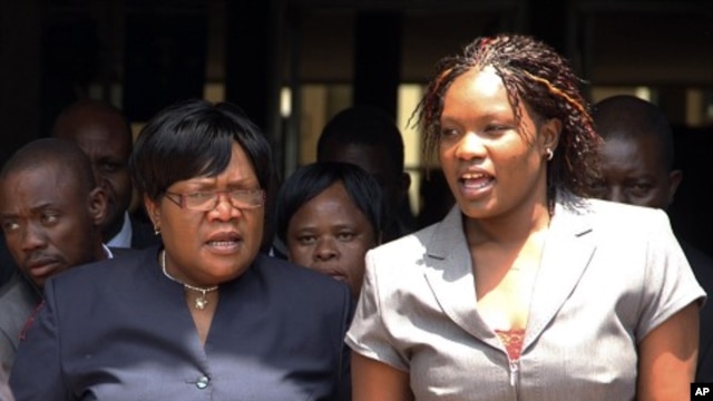 Zimbabwean deputy President Joice Mujuru, left, leaves the Harare magistrates court accompanied by her daughter Kumbirai in Harare,  January 17, 2012