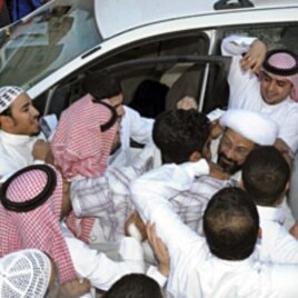 Saudi Shi'ite cleric Tawfiq al-Amir (R) greets supporters in Al-Ahsa, Mar 6 2011, after his release from prison. He was arrested for calling for a constitutional monarchy and a fight against corruption, witnesses and human rights activists said