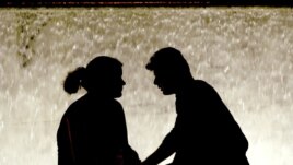 A couple in Athens' Syntagma Square