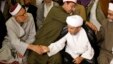 Iraqi Muslim worshippers shake hands during a joint Sunni-Shi'ite Friday prayer at the Martyrs Monument in Baghdad, May 24, 2013.