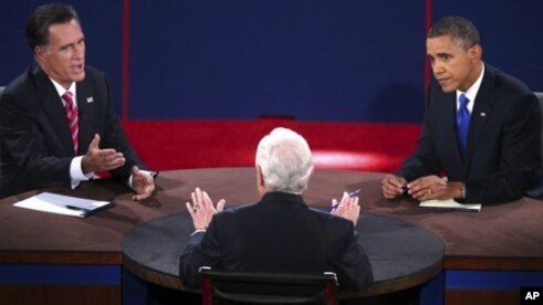 Republican presidential nominee Mitt Romney answers a question as President Barack Obama listens during the third presidential debate at Lynn University in Boca Raton, Florida, October 22, 2012.