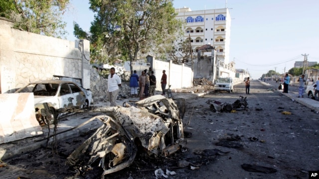 Wreckage is seen after an attack outside the Jazeera Hotel in Mogadishu, Jan. 2, 2014.  