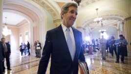 Sen. John Kerry walks to the Senate floor on Capitol Hill in Washington, Tuesday, Dec. 4, 2012.