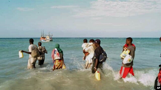People waiting to board a boat to take them across the Gulf of Aden (file photo)