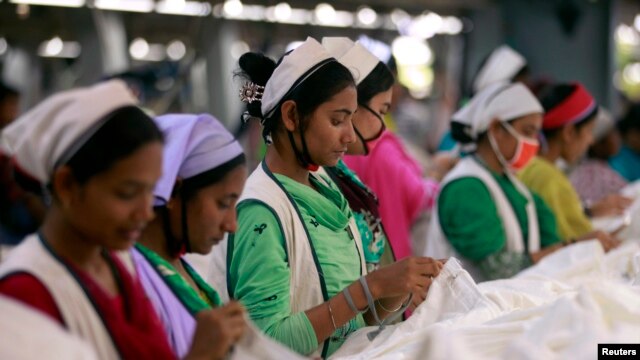 Women work at Goldtex Limited garment factory inside the Dhaka Export Processing Zone (DEPZ) in Savar, April 11, 2013. 