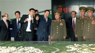 North Korean envoy Choe Ryong Hae, center right, tours Beijing Economic-Technological Development Area, an industrial park in the southern part of Beijing, May 23, 2013.