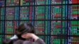 An investor monitors the stock market at a securities brokerage in Taipei, Apr. 16, 2013.