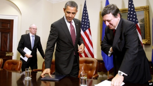 President Barack Obama, European Council President Herman Van Rompuy, left, and European Commission President Jose Manuel Barroso in the Roosevelt Room of the White House Washington, Monday, Nov. 28, 2011.