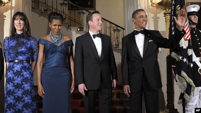 President Barack Obama and first lady Michelle Obama pose for an official photo with British Prime Minister David Cameron and his wife, Samantha Cameron, before the White House state dinner, March 14, 2012.